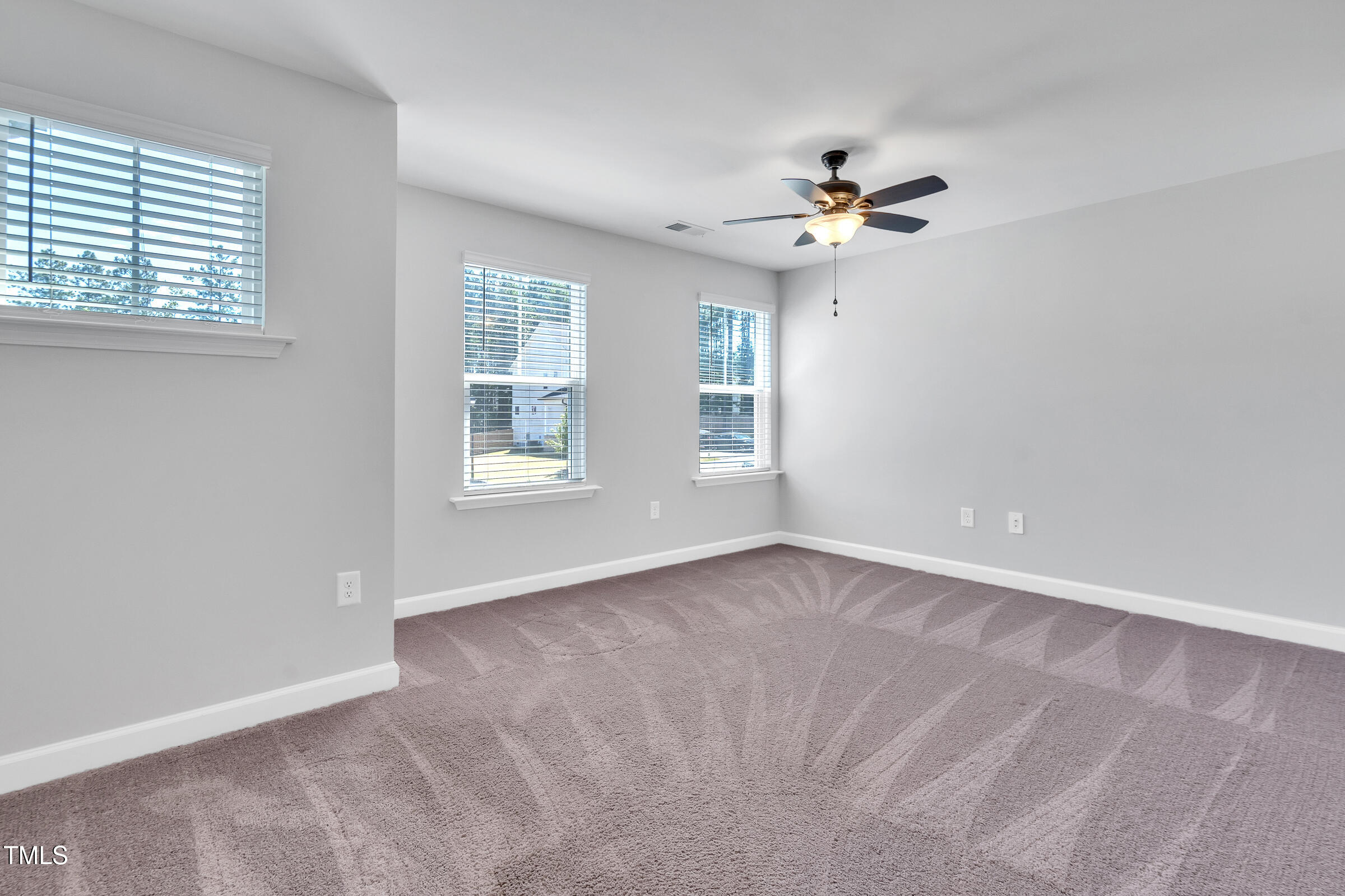 61 Cascade Place Clayton, NC 27527 - Photo 27 of 33 a view of an empty room with a window