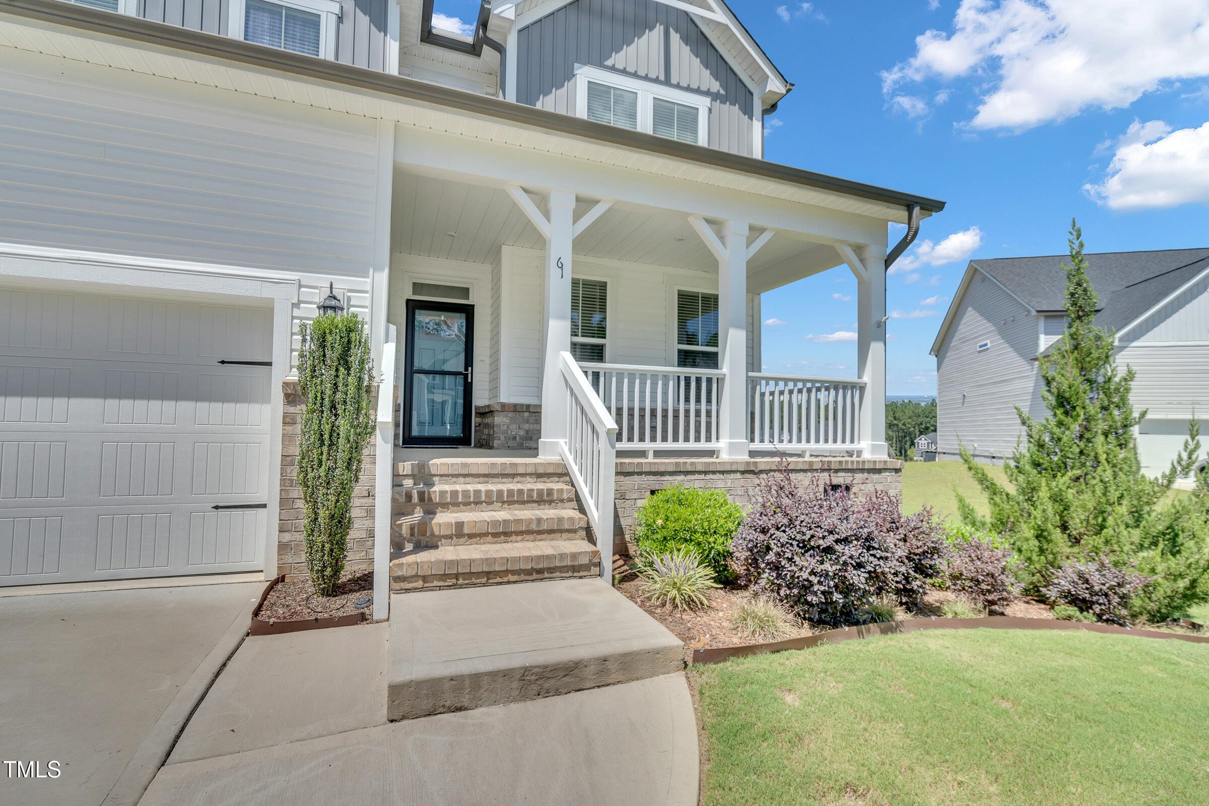 61 Cascade Place Clayton, NC 27527 - Photo 3 of 33 a front view of a house with a yard