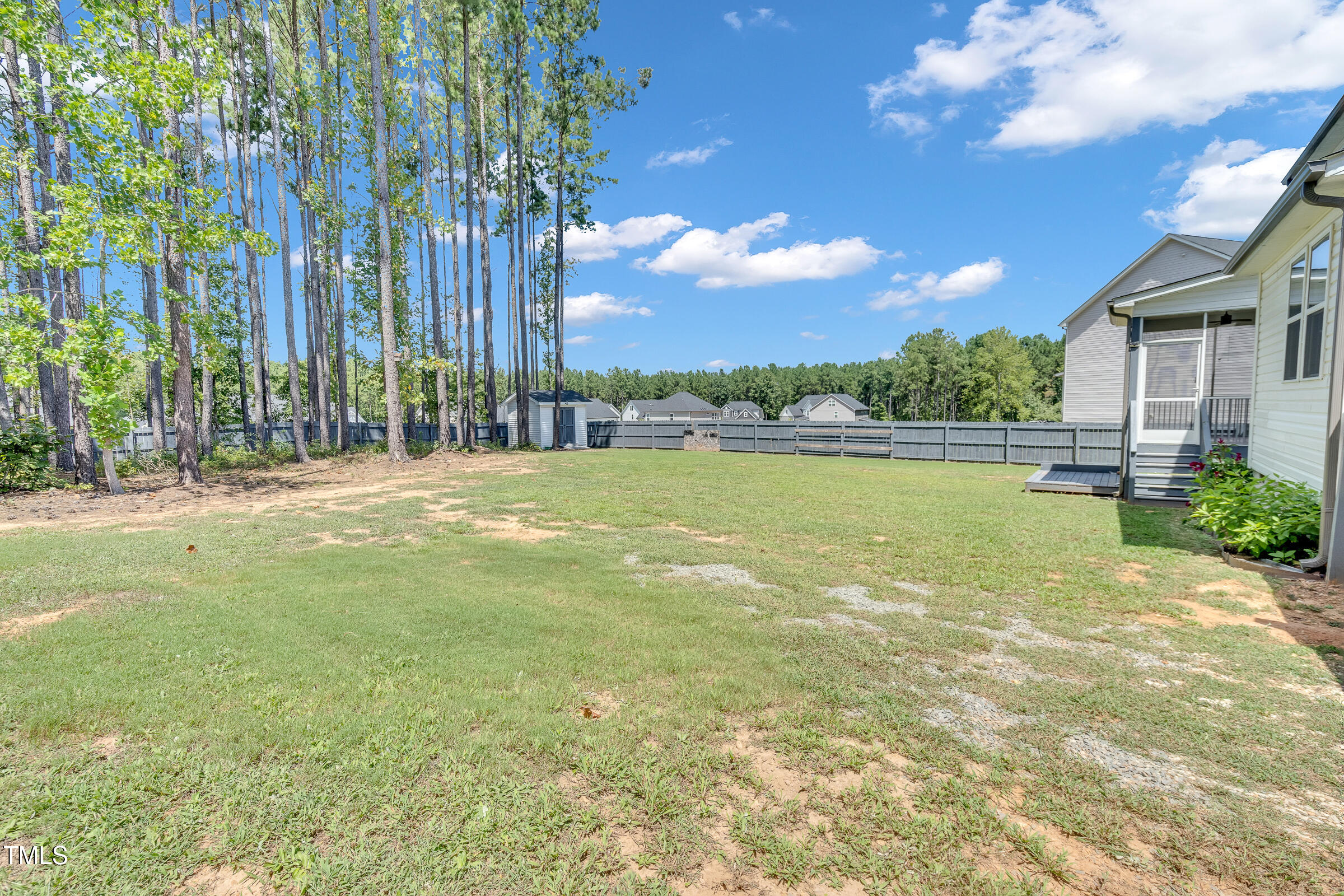 61 Cascade Place Clayton, NC 27527 - Photo 31 of 33 a view of a yard with a house in the background