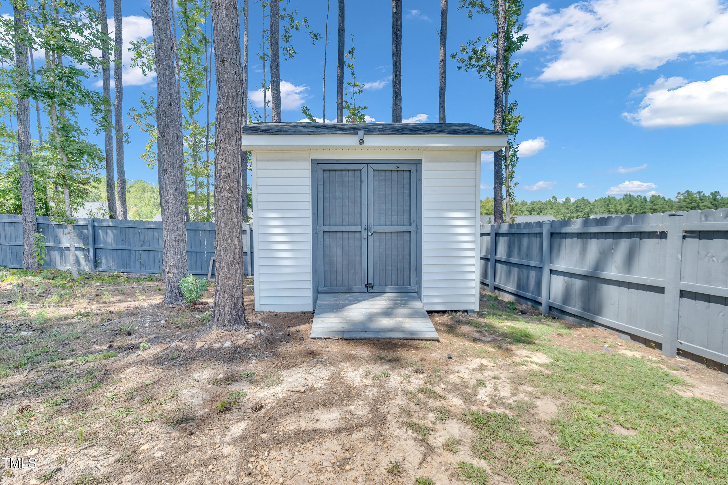 61 Cascade Place Clayton, NC 27527 - Photo 33 of 33 a view of a house with backyard and wooden fence