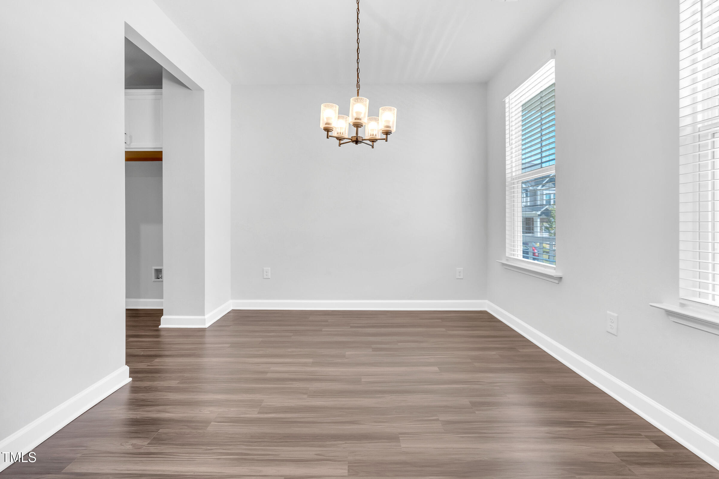 61 Cascade Place Clayton, NC 27527 - Photo 6 of 33 a view of a room with wooden floor and windows