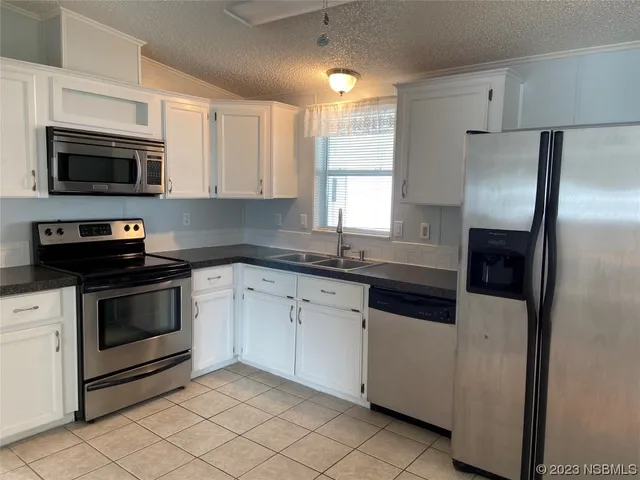 a balcony with wooden floor and outdoor seating