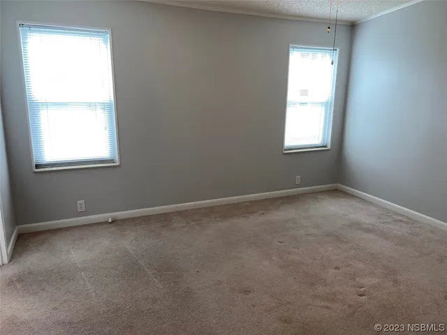 a view of house with backyard and outdoor seating