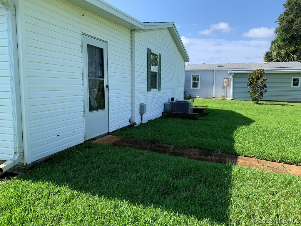 626 Starboard Avenue Edgewater, FL 32141 - Photo 24 of 38 a view of a house with backyard and garden