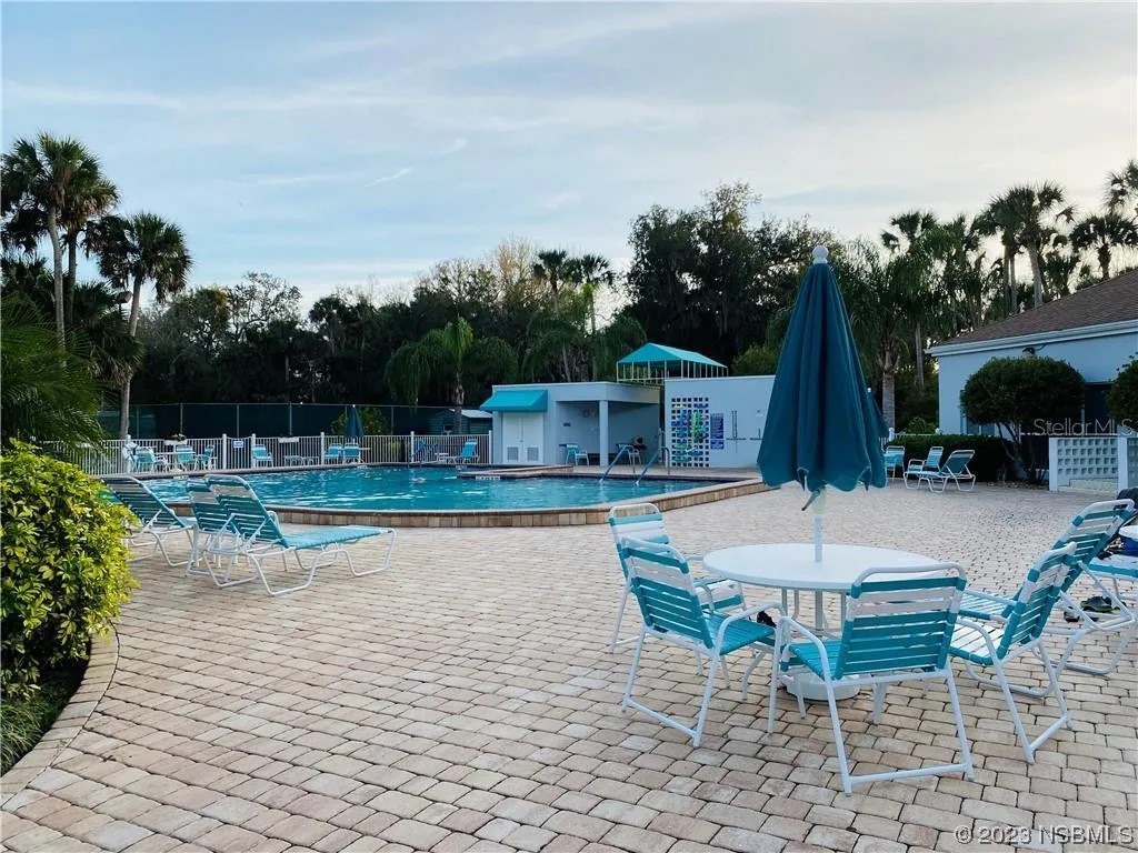 626 Starboard Avenue Edgewater, FL 32141 - Photo 37 of 38 a view of house with backyard and outdoor seating