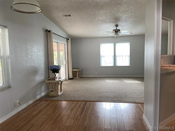 a bathroom with a shower and a sink