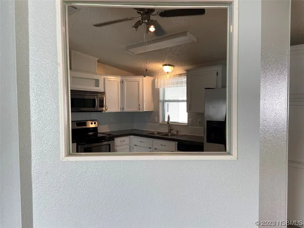 a view of a room that has a window in it