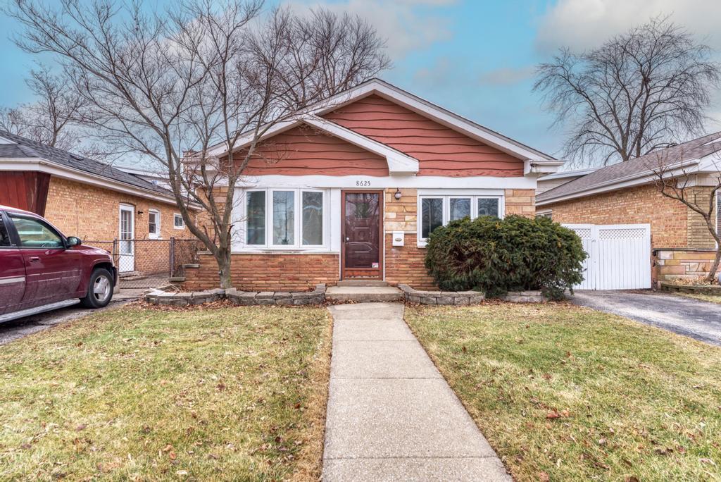 8625 43rd Street Lyons, IL 60534 - Photo 1 of 22 a view of a house with a yard
