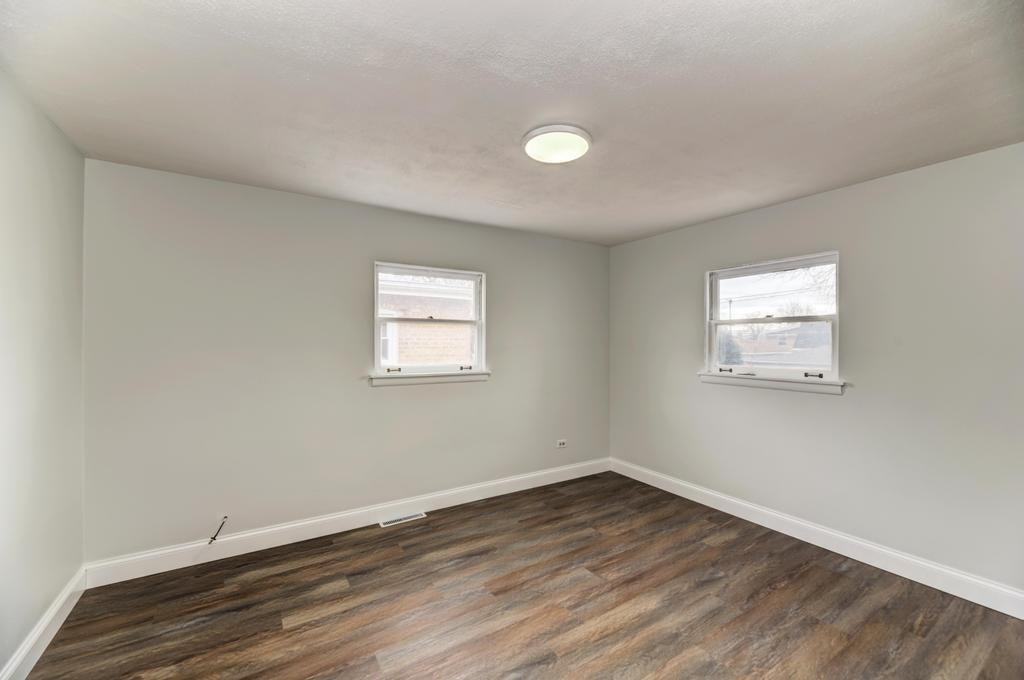 8625 43rd Street Lyons, IL 60534 - Photo 12 of 22 wooden floor in an empty room