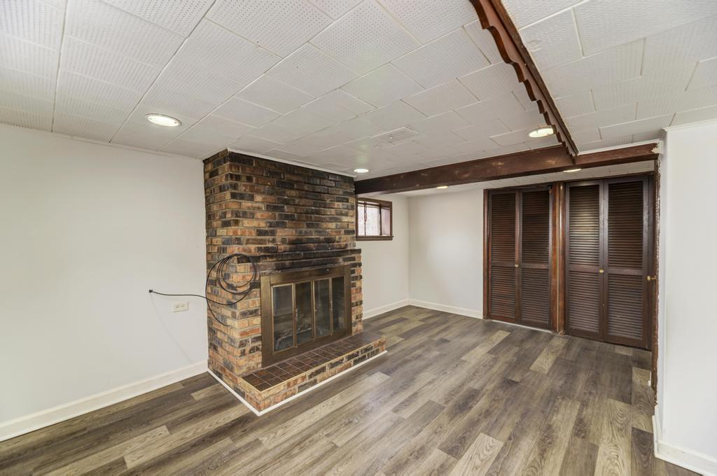 8625 43rd Street Lyons, IL 60534 - Photo 17 of 22 a view of an empty room with a fireplace