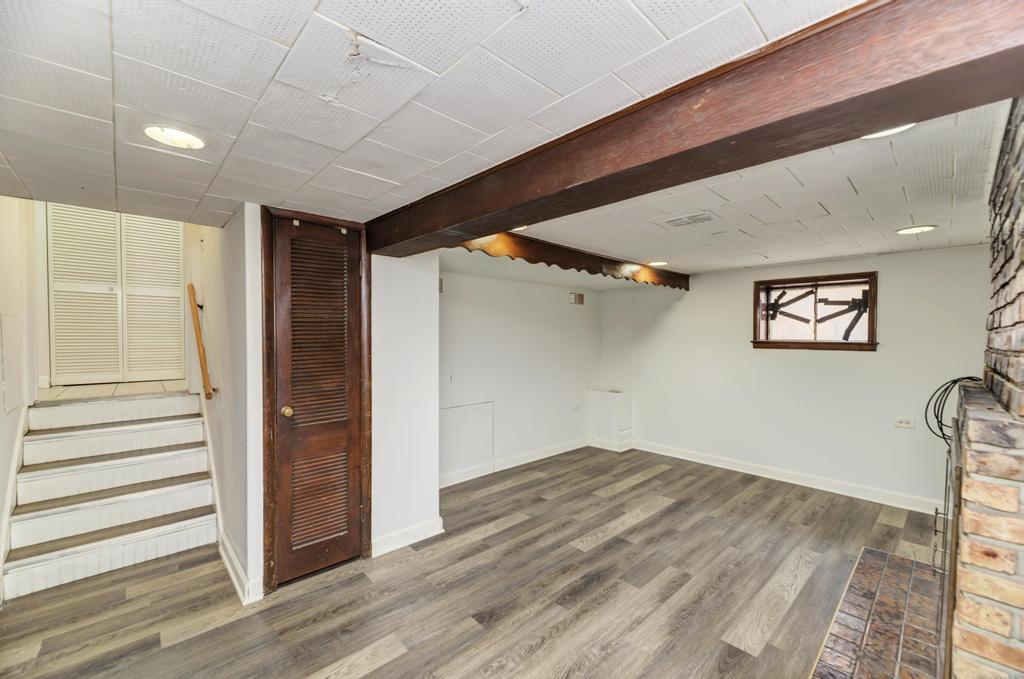 8625 43rd Street Lyons, IL 60534 - Photo 18 of 22 a view of a hallway with wooden floor