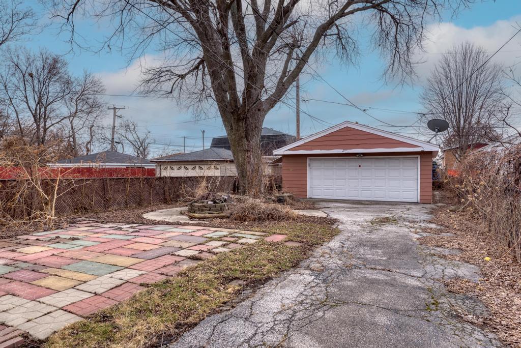 8625 43rd Street Lyons, IL 60534 - Photo 22 of 22 a front view of a house with a yard and garage