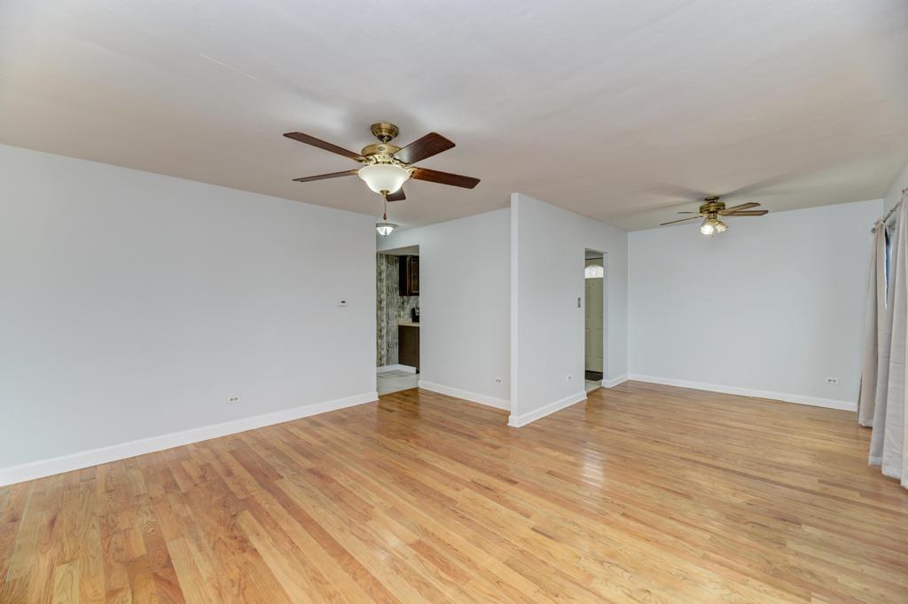 8625 43rd Street Lyons, IL 60534 - Photo 4 of 22 wooden floor in an empty room