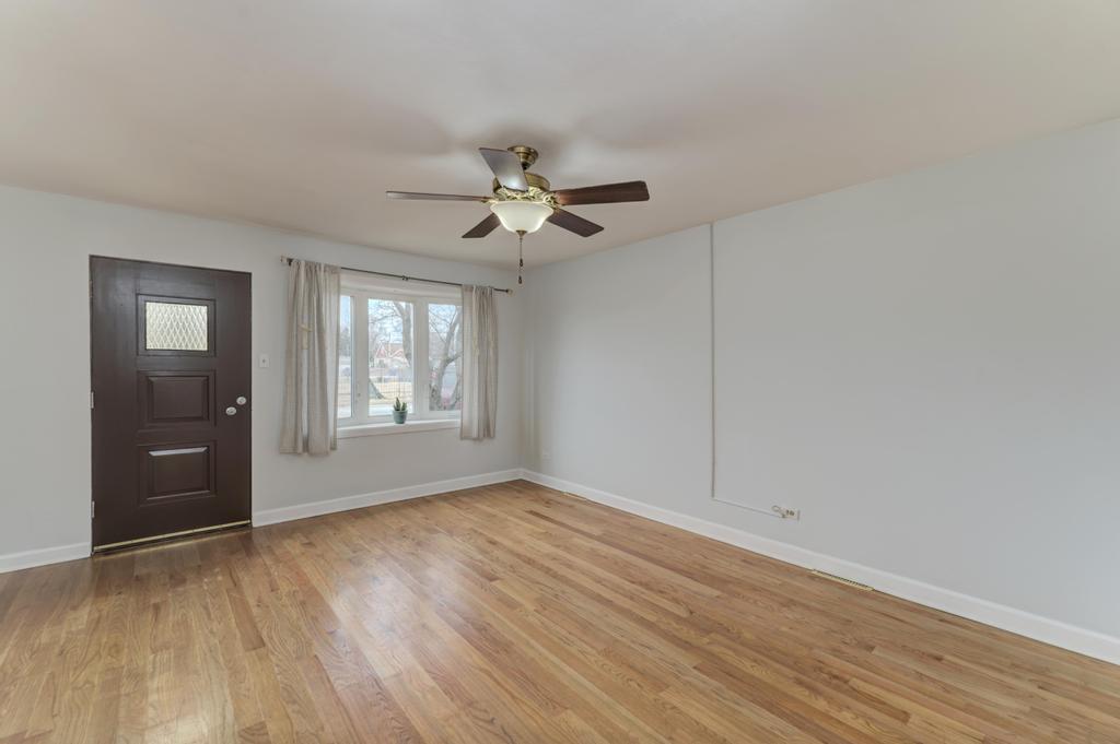 8625 43rd Street Lyons, IL 60534 - Photo 5 of 22 wooden floor in an empty room with a window