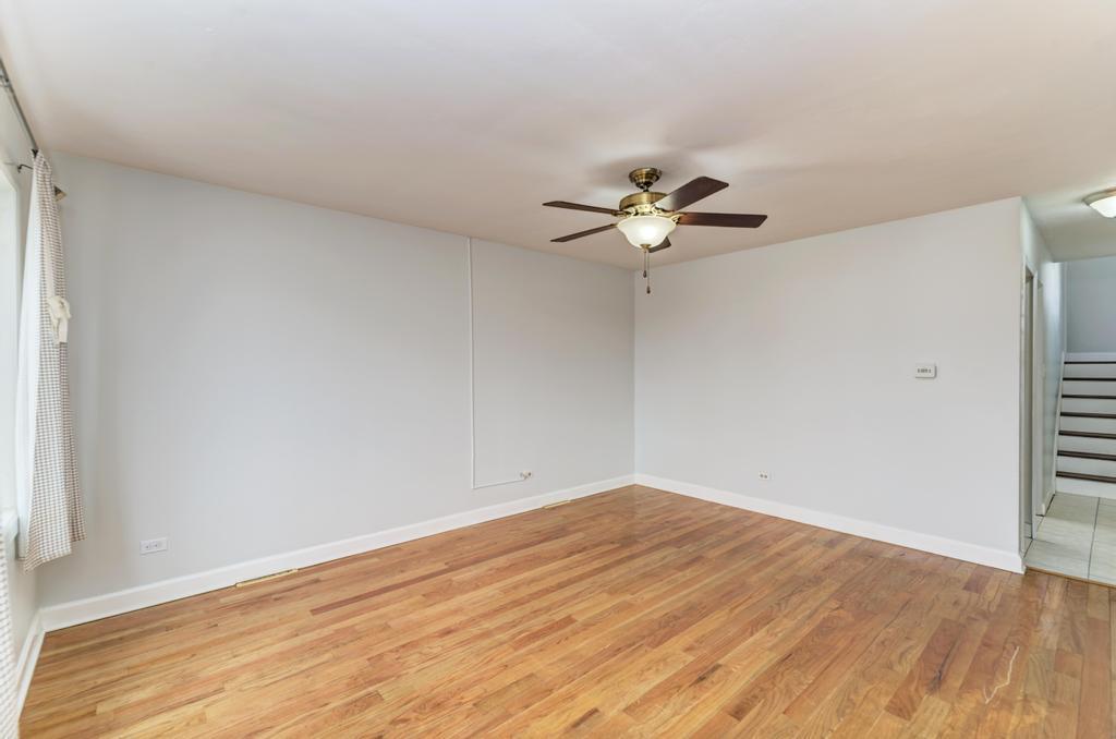 8625 43rd Street Lyons, IL 60534 - Photo 6 of 22 wooden floor in an empty room