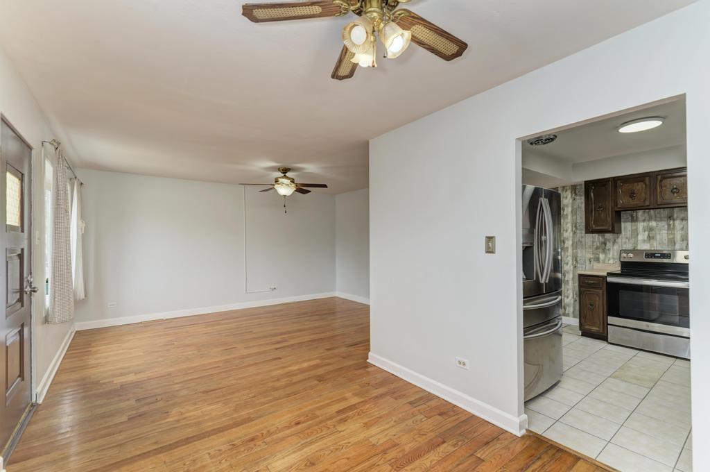 8625 43rd Street Lyons, IL 60534 - Photo 7 of 22 wooden floor in an empty room with a window