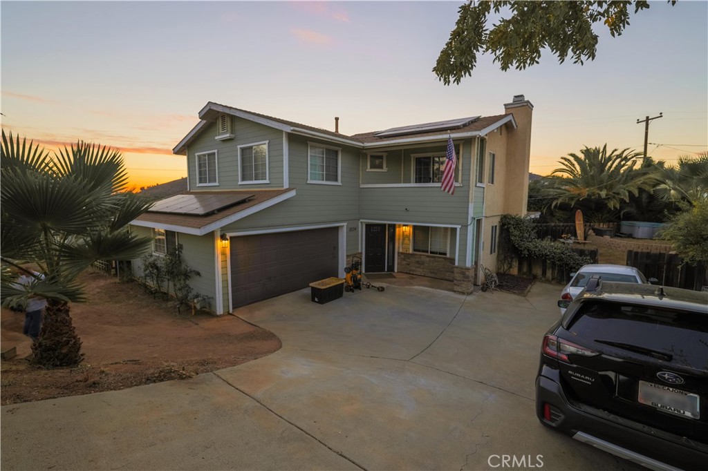 a view of a car park in front of house