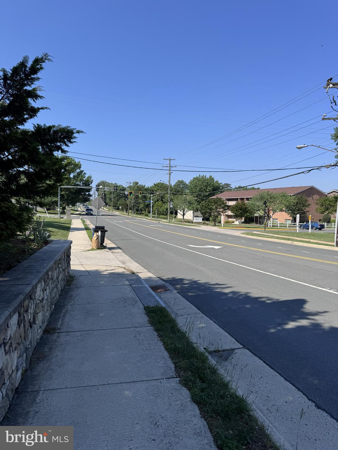 3621 Jermantown Road Fairfax, VA 22030 - Photo 4 of 6 a view of a street with a building in the background