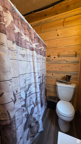 5782 Pineview Loop, Unit 921 Kamas, UT 84036 - Photo 8 of 29 Bathroom featuring wood plank walls and wood-finish flooring