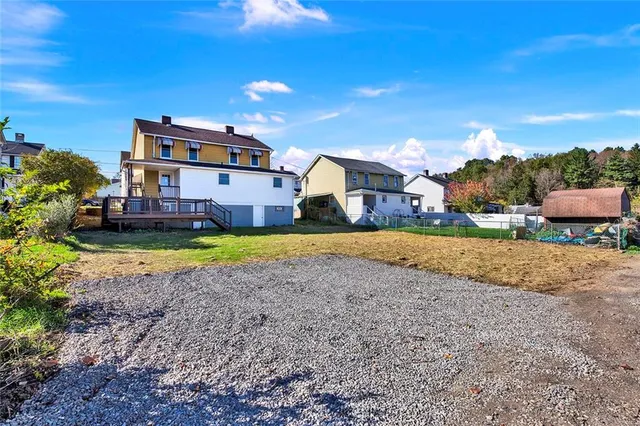 a view of a house with a big yard