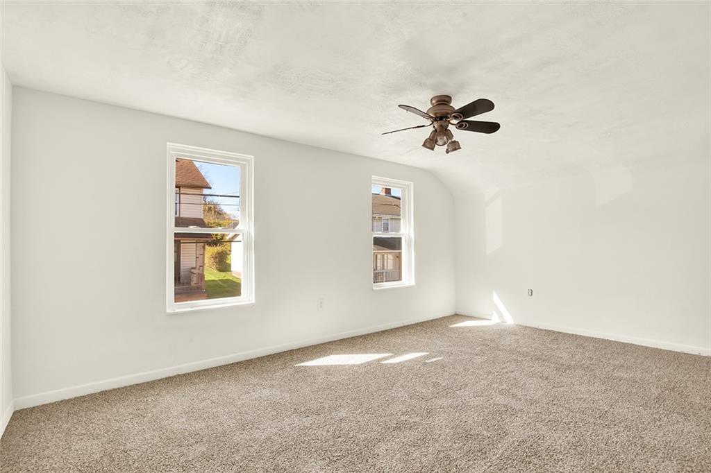 20 Oak Street Russellton, PA 15076 - Photo 14 of 31 an empty room with windows and a ceiling fan