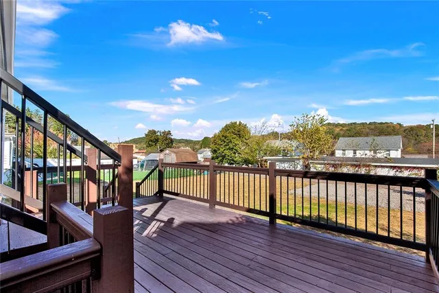 a view of a balcony with furniture