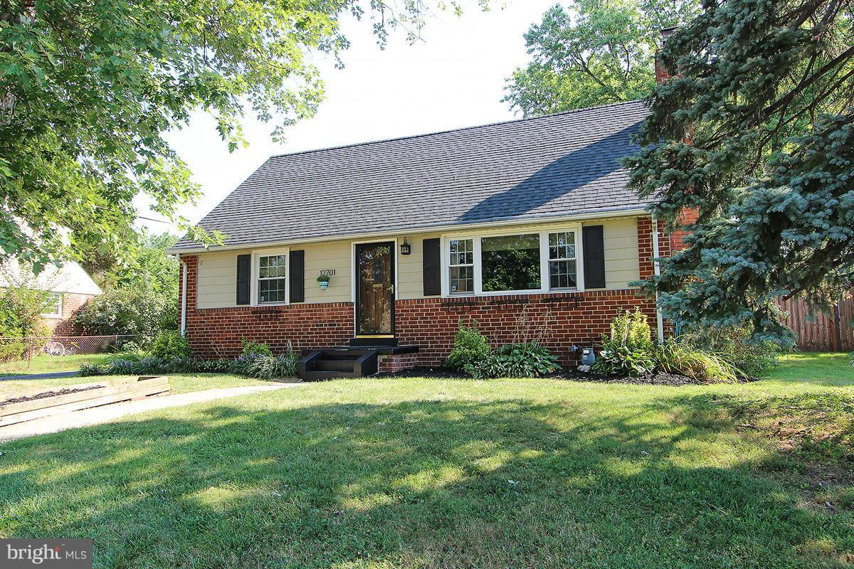 12701 Holdridge Road Silver Spring, MD 20906 - Photo 1 of 30 a view of a house with a yard and plants