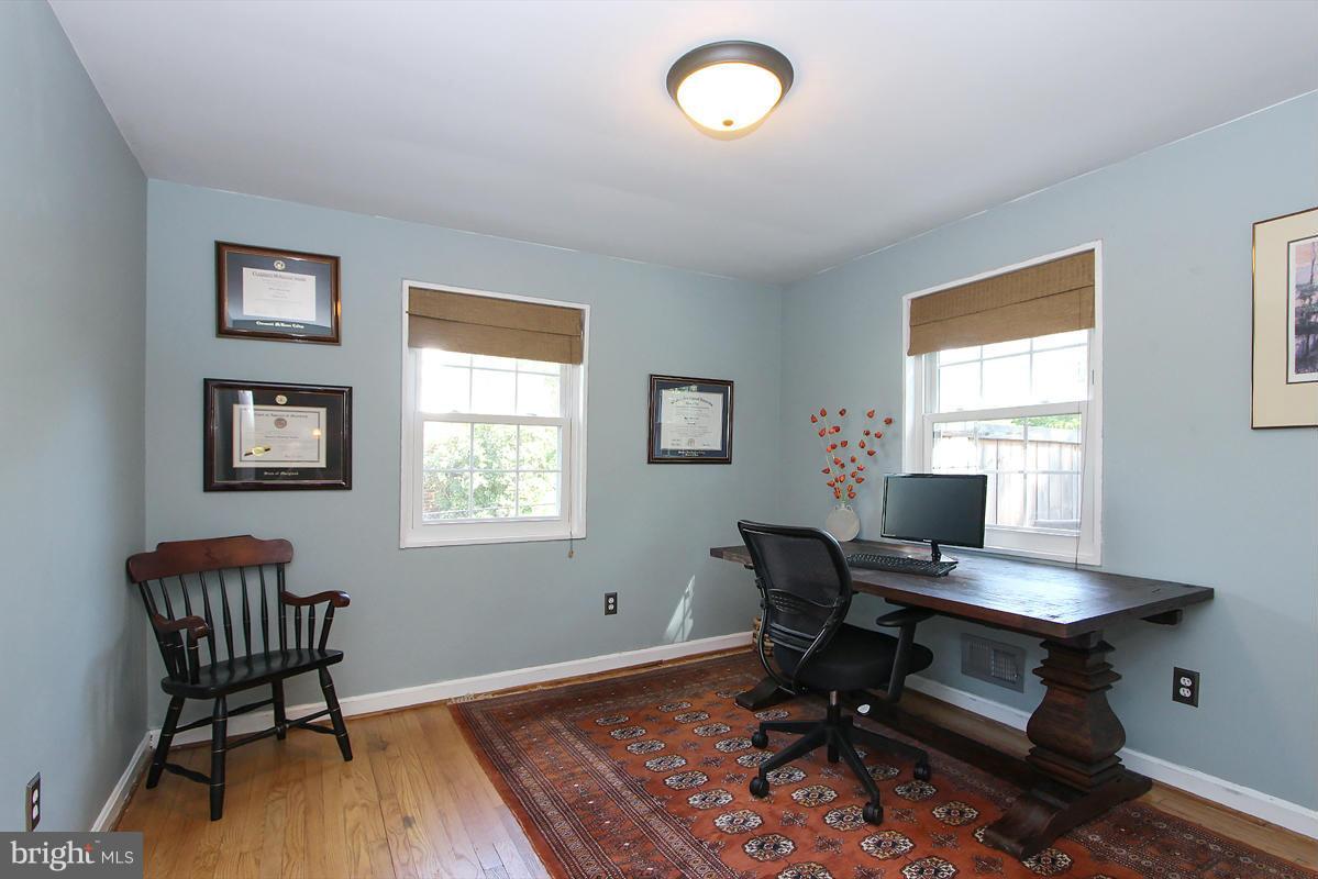 12701 Holdridge Road Silver Spring, MD 20906 - Photo 14 of 30 a workspace with wooden floor and a window