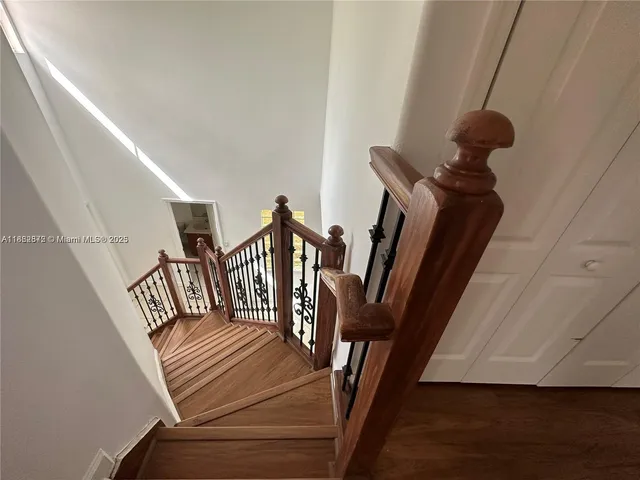 a view of an entryway with wooden floor