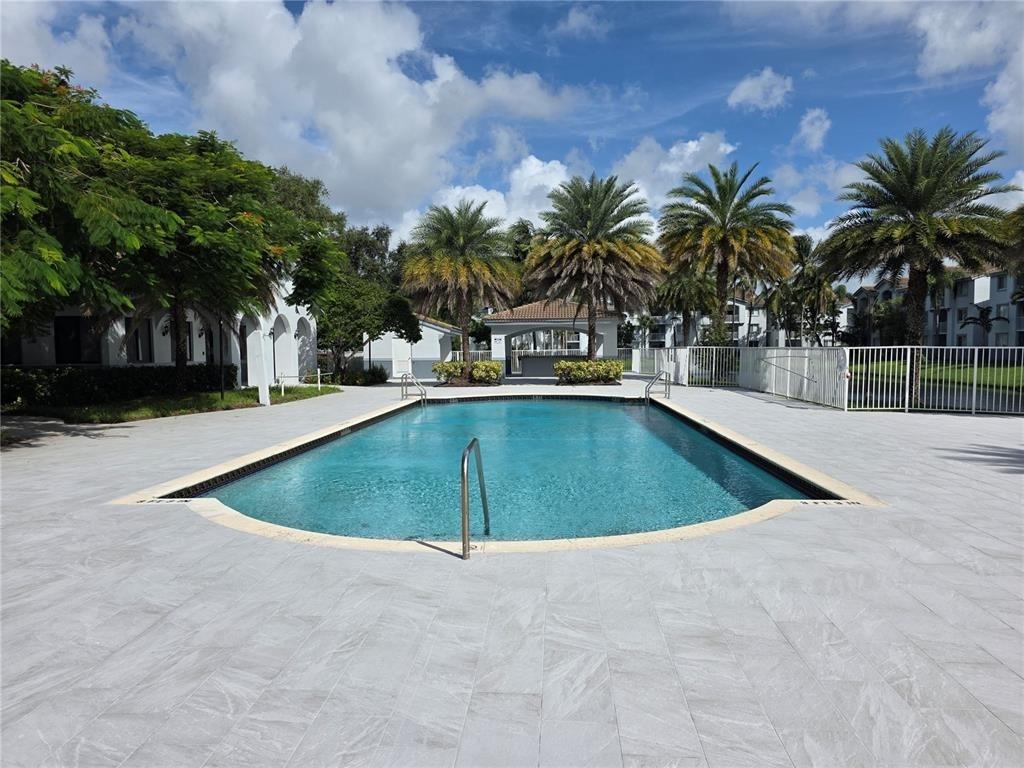 2640 South University Drive, Unit 129 Davie, FL 33328 - Photo 12 of 15 a view of outdoor space and swimming pool