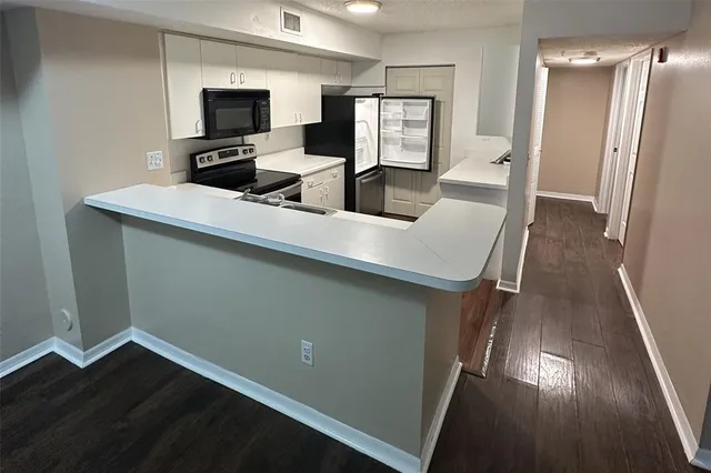 a room with furniture and a flat screen tv
