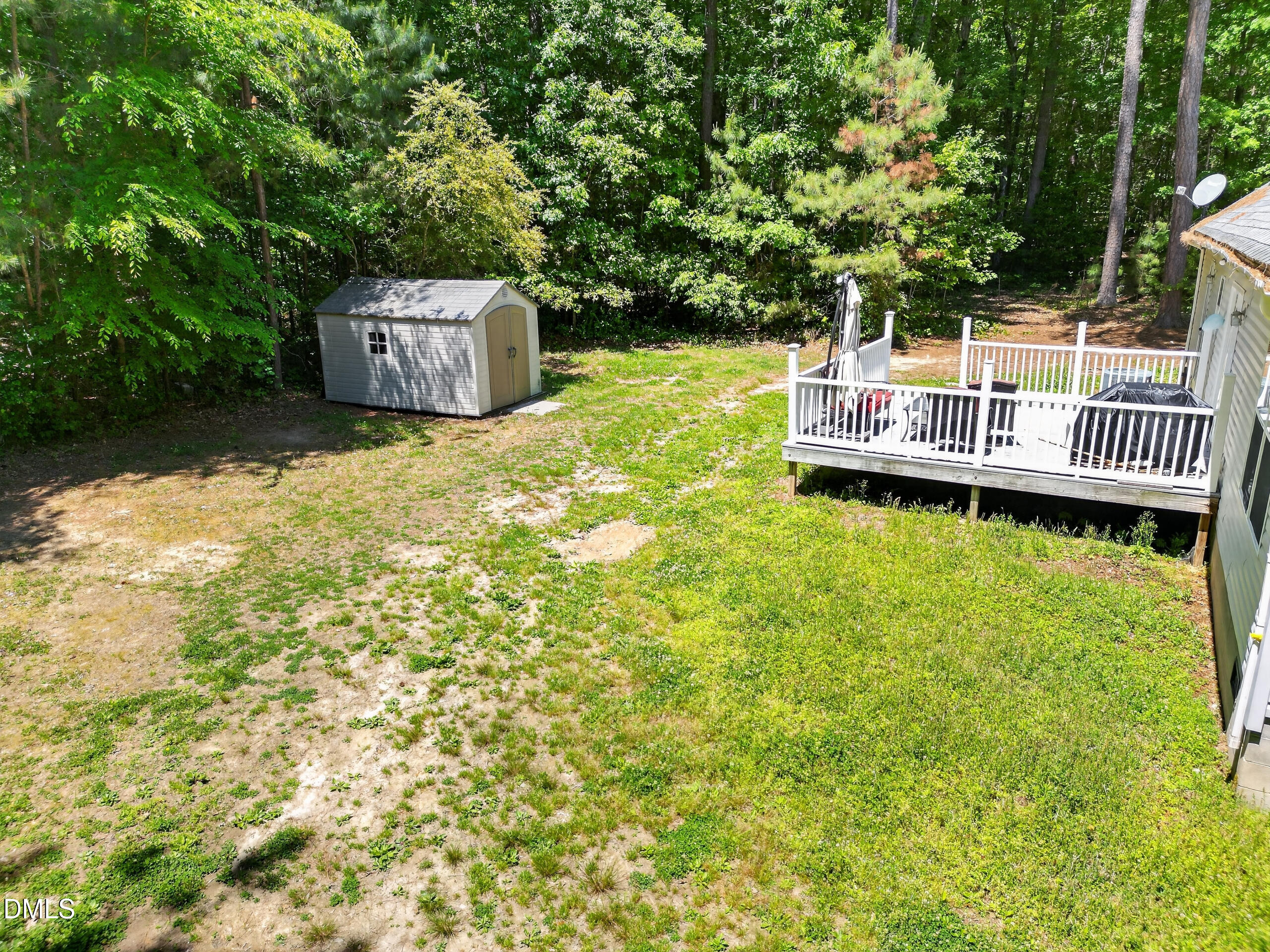 126 Hunter Road Henderson, NC 27537 - Photo 5 of 5 a backyard of a house with table and chairs