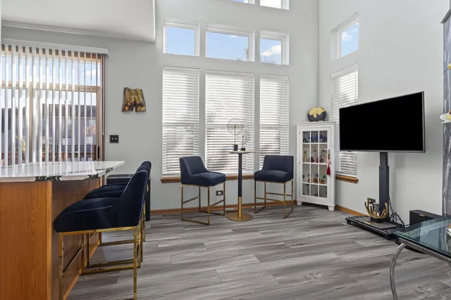 a view of a livingroom with furniture and a flat screen tv