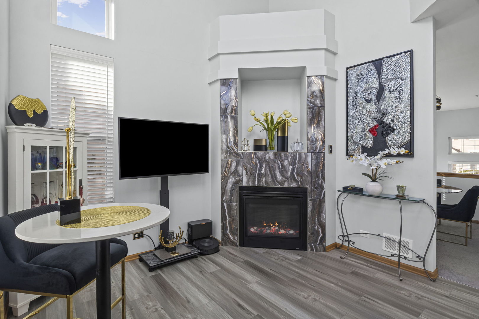 21617 Dogwood Road, Unit 1125 Matteson, IL 60443 - Photo 12 of 33 a living room with furniture a flat screen tv and a fireplace