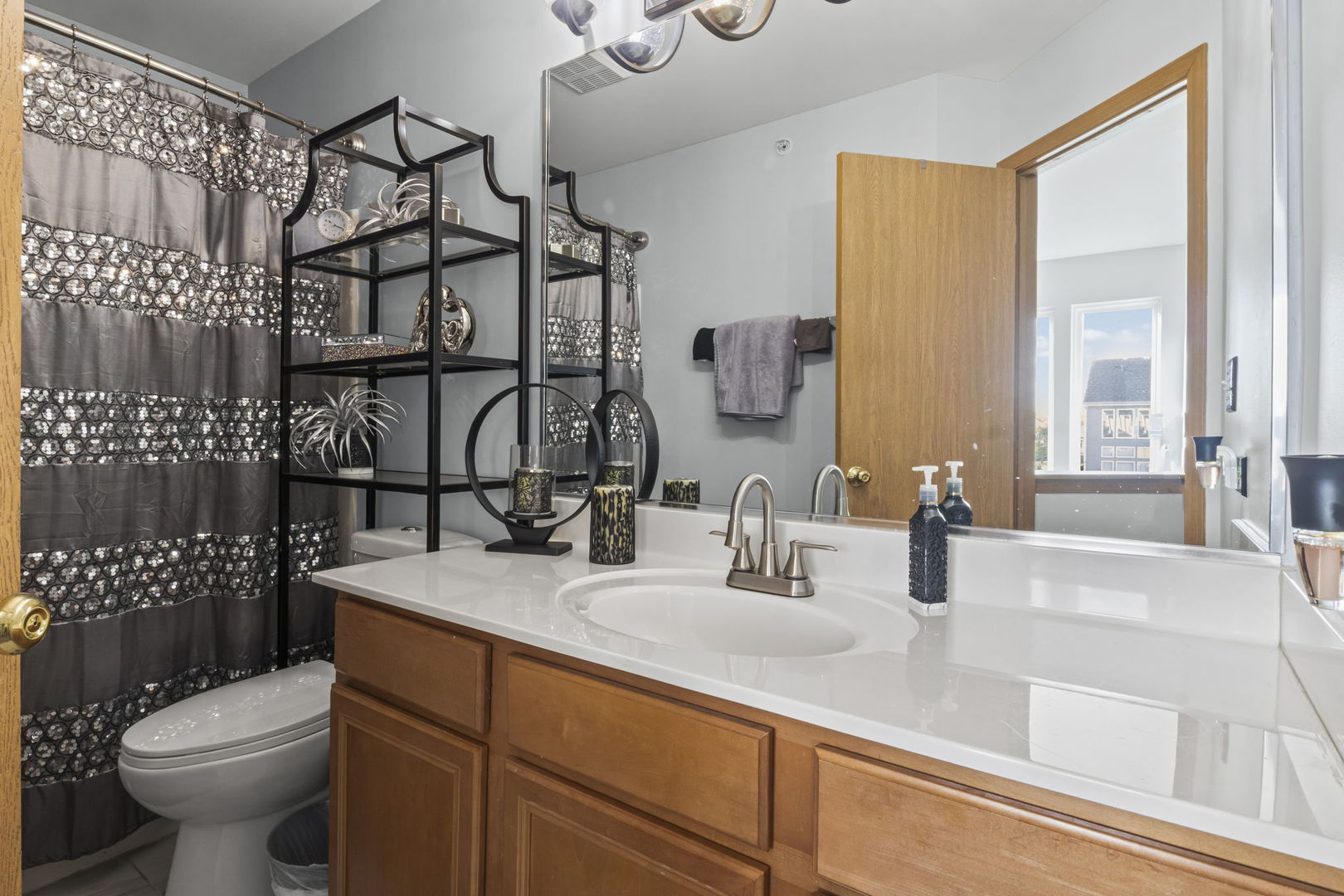 21617 Dogwood Road, Unit 1125 Matteson, IL 60443 - Photo 24 of 33 a bathroom with a sink toilet and shower