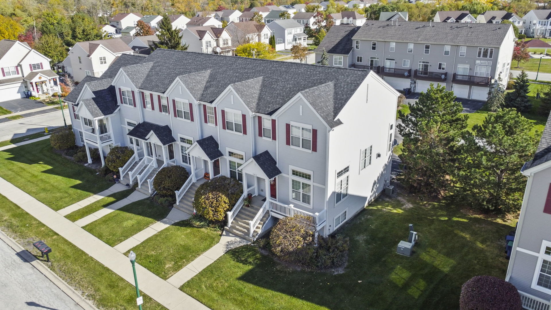 21617 Dogwood Road, Unit 1125 Matteson, IL 60443 - Photo 32 of 33 a aerial view of a house with swimming pool and large trees