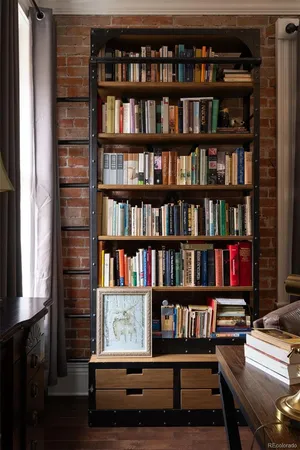 a workspace with a book shelf