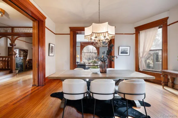 a view of a dining room with furniture window and wooden floor