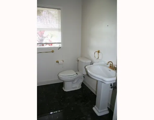 a bathroom with a toilet and a sink