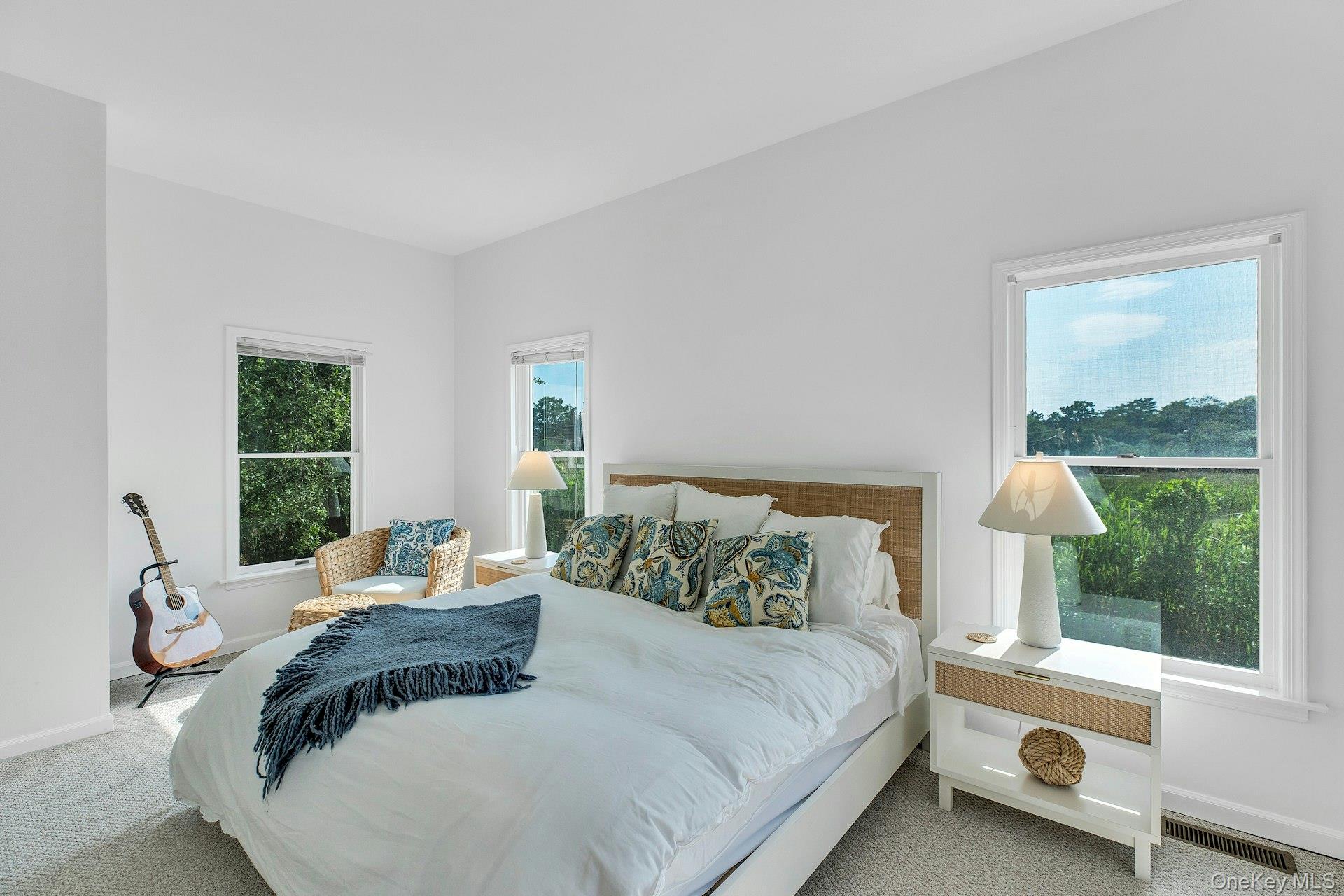 56 South Country Road Westhampton, NY 11977 - Photo 17 of 43 a bedroom with a bed and a window