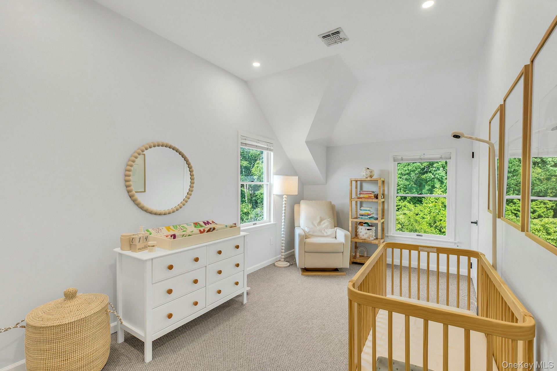 56 South Country Road Westhampton, NY 11977 - Photo 19 of 43 a bedroom with furniture and a large window