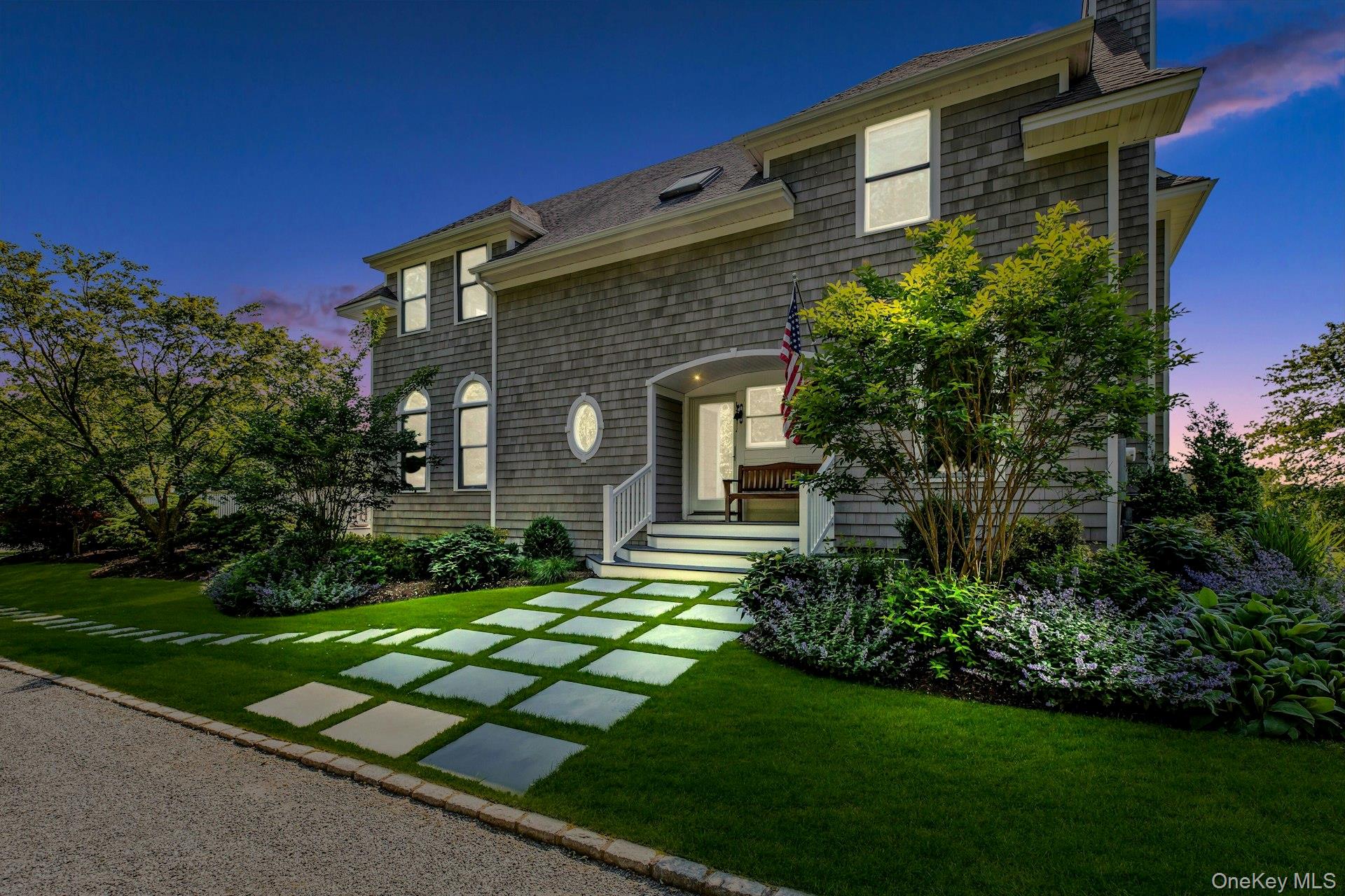 56 South Country Road Westhampton, NY 11977 - Photo 2 of 43 a front view of house with yard and green space