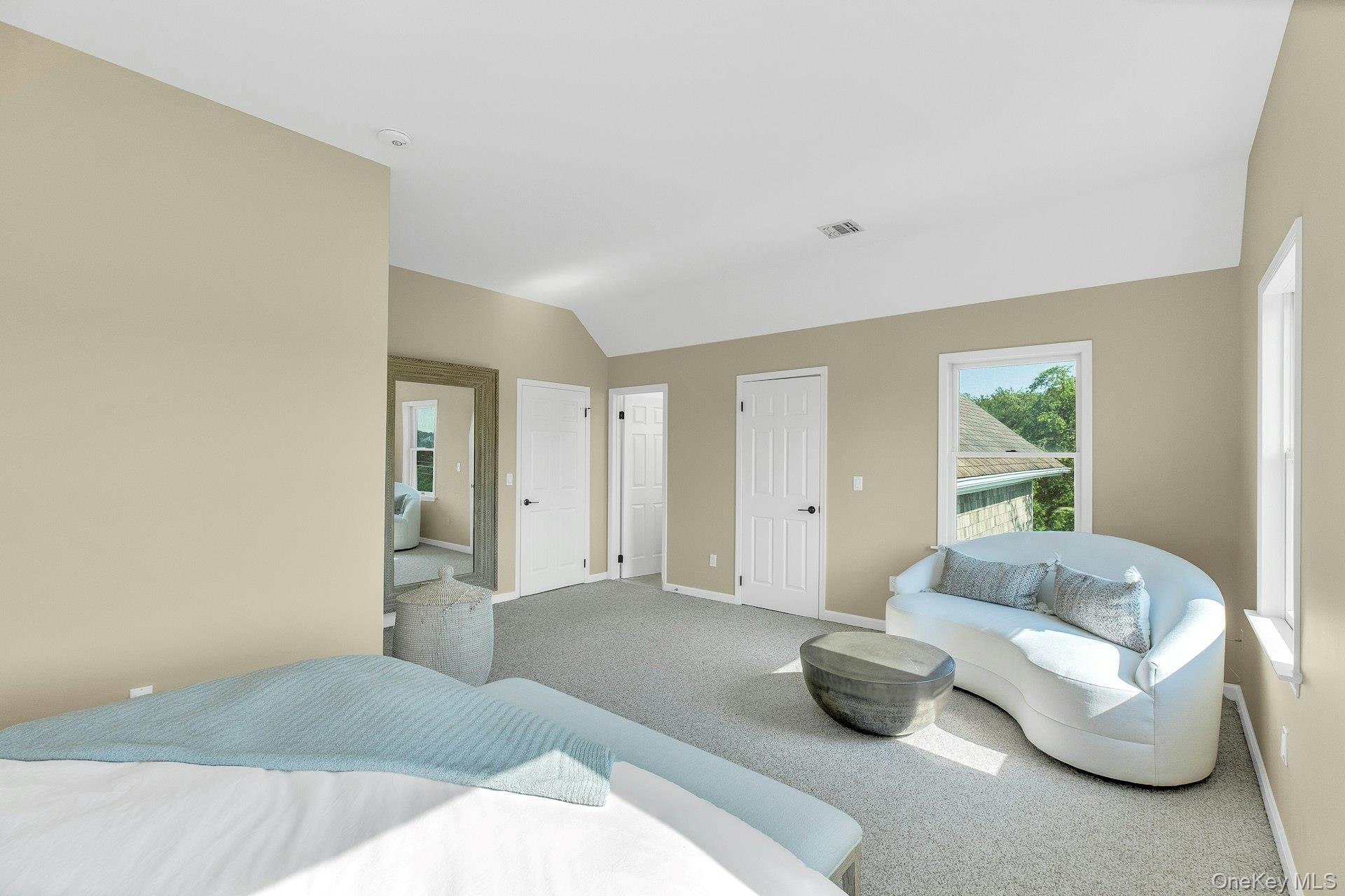 56 South Country Road Westhampton, NY 11977 - Photo 22 of 43 a living room with furniture and a window