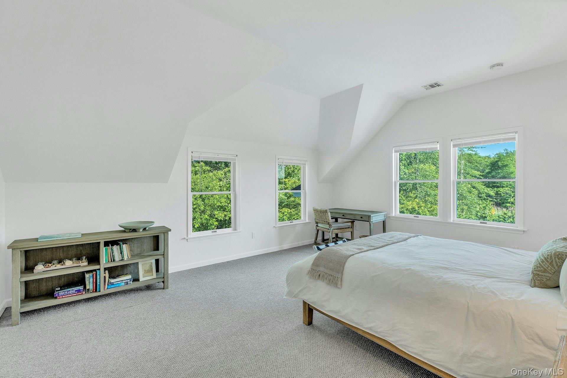 56 South Country Road Westhampton, NY 11977 - Photo 24 of 43 a spacious bedroom with a bed and a window