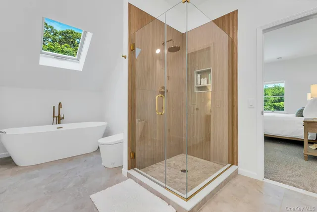 a bathroom with a shower a mirror and a shower