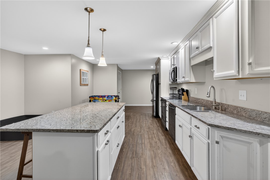 136 Loran Pointe Circle Seneca, SC 29672 - Photo 29 of 50 Granite counters and recessed lighting elevate this well-appointed kitchen, perfect for culinary endeavors.