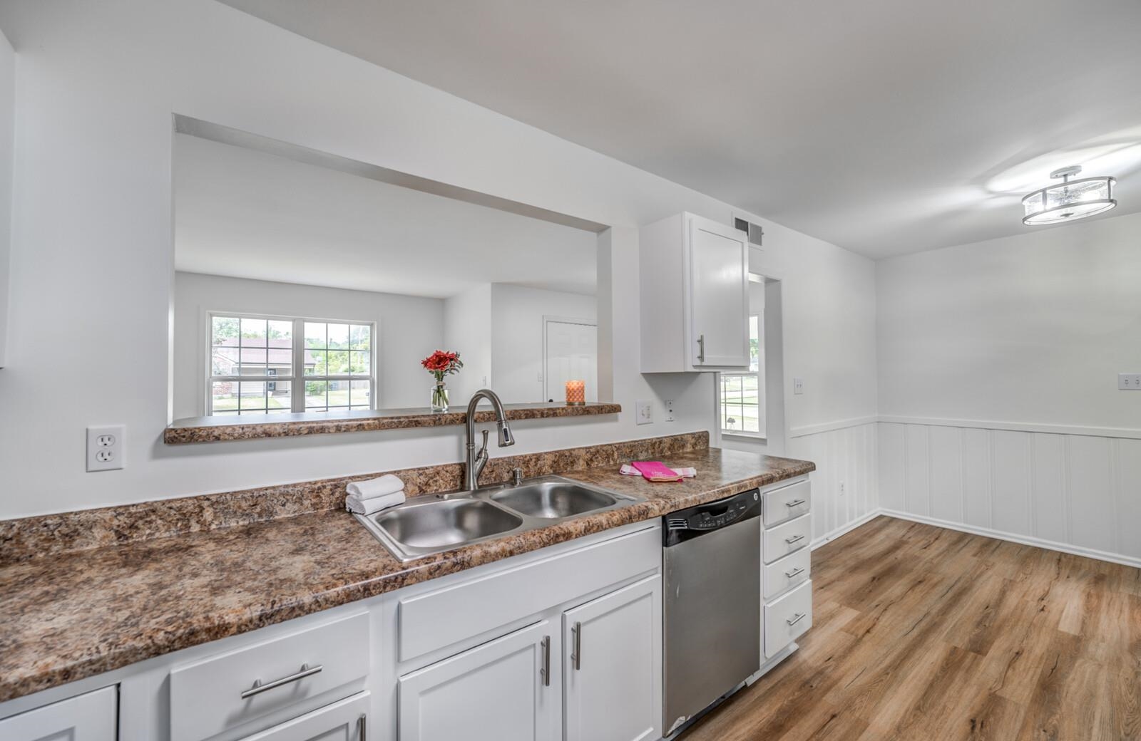 5600 Manley Road Memphis, TN 38120 - Photo 16 of 31 a kitchen with a sink and cabinets