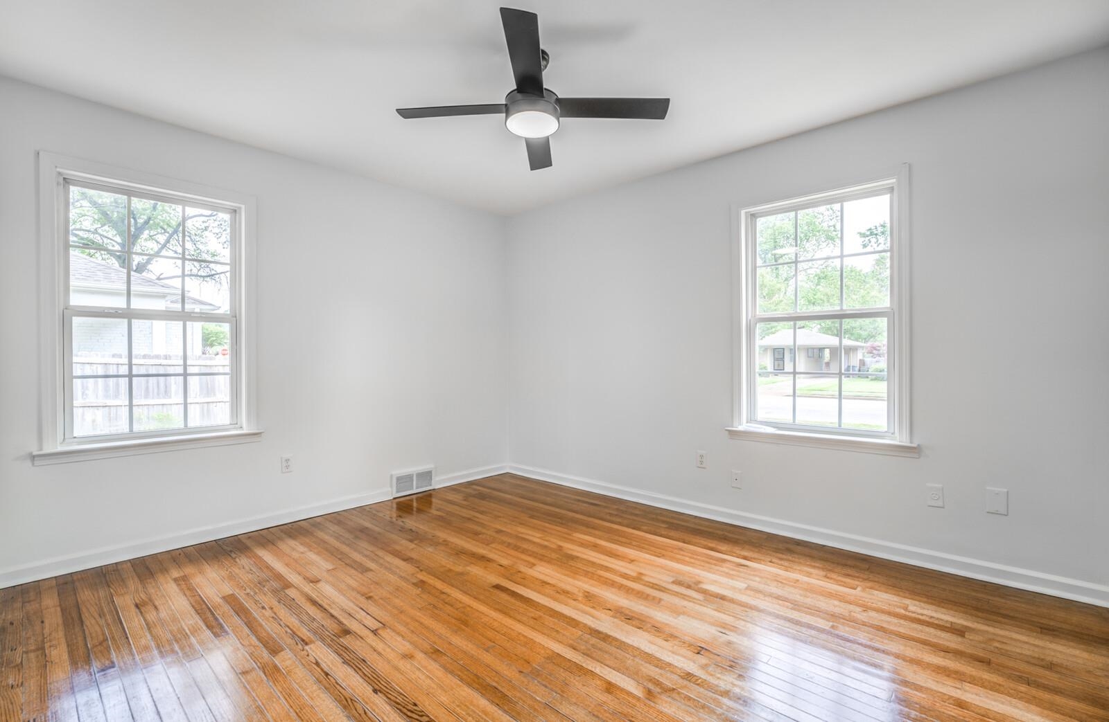 5600 Manley Road Memphis, TN 38120 - Photo 18 of 31 a view of empty room with wooden floor and fan