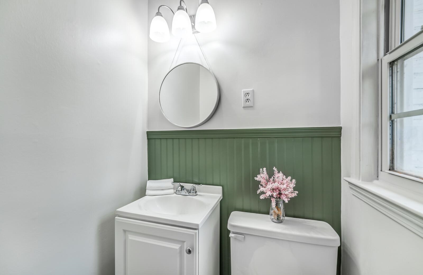 5600 Manley Road Memphis, TN 38120 - Photo 21 of 31 a bathroom with a sink mirror and toilet