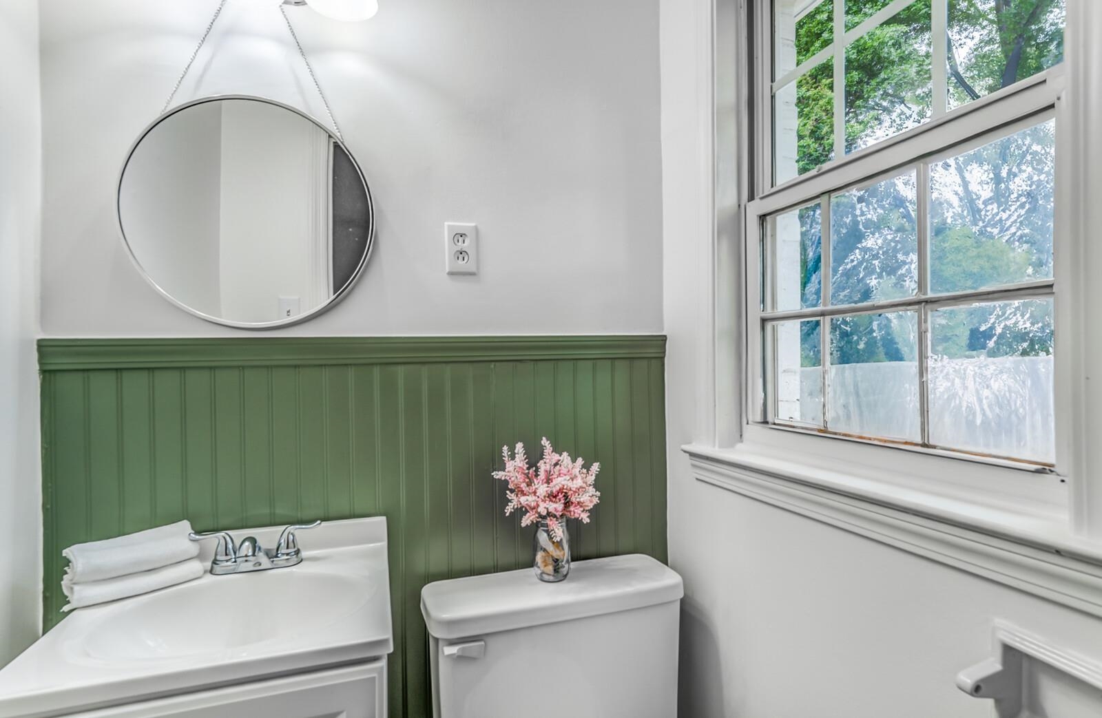 5600 Manley Road Memphis, TN 38120 - Photo 22 of 31 a bathroom with a sink mirror and toilet